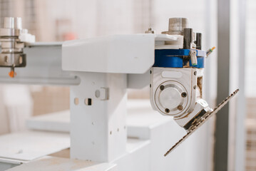 Circular saw for cutting wood materials on a woodworking machine at a furniture factory