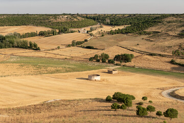 Fototapeta na wymiar View of of the fields and dovecoats since the medieval village of Uruena at sunset.