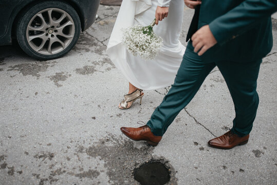 real bride and groom holding hands