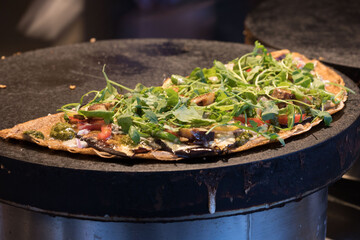 pizza being baked on a stove 