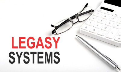 LEGACY SYSTEMS Concept. Calculator,pen and glasses on the white background