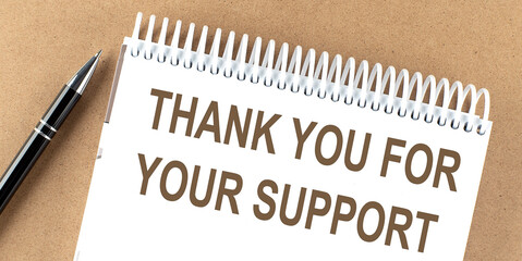 THANK YOU FOR YOUR SUPPORT text on a notepad with pen, business concept