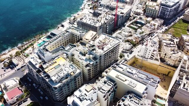 City development with industrial cranes. Construction site. Aerial view