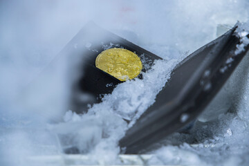  A representative crypto currency cold wallet image, which a real wallet is inside a fridge and ice cubes around and a bitcoin figurine inside the wallet