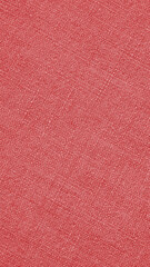 Fototapeta premium Pale red woven surface close-up. Linen texture. Textured mobile phone wallpaper. Fabric vertical background. Braided simple backdrop