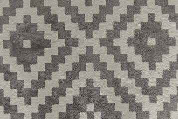 Textile carpet. Black and white soft rug in moroccan style. Abstract texture background with diamond geometric pattern.