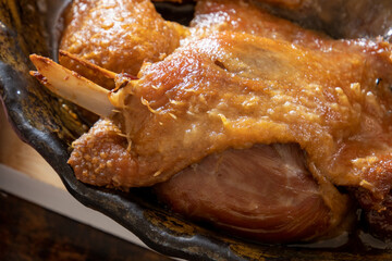 close up of cooked duck confit in dish