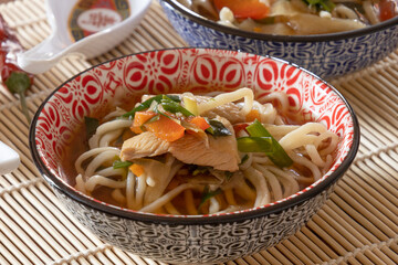 thai style noodle soup with chicken and vegetables, healthy food