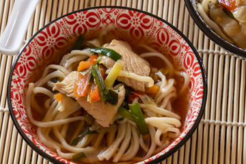 thai style noodle soup with chicken and vegetables, healthy food