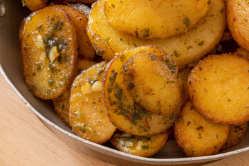 sarladaise potatoes in a dish with rosemary