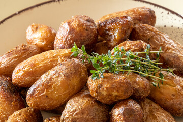 close up of baked potatoes with herbs