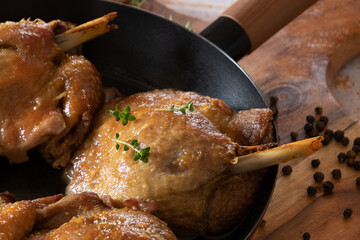 close up of cooked duck confit in dish