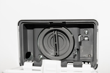 Washing machine drain clean, close-up. Open filter cover of washing machine