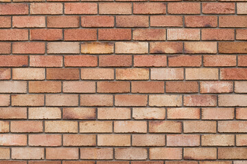 wall of red baked bricks, even masonry