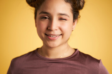 portrait of young girl with winking eye