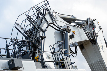 Big excavator in coal mine at cloudy day, low angle view