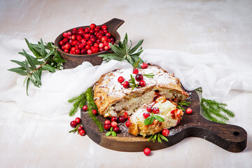 Delicious cranberry pie with fresh cranberries and herbs for Christmas on wooden plate - 498512406