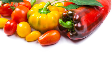 Assorted tomatoes and vegetables isolated on white background. Photo for your design. - 498512407