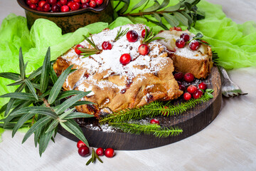 Delicious cranberry pie with fresh cranberries and herbs for Christmas on wooden plate - 498512409