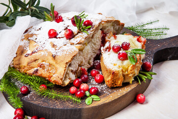 Delicious cranberry pie with fresh cranberries and herbs for Christmas on wooden plate - 498512410