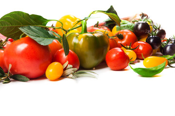 Assorted tomatoes and vegetables isolated on white background. Photo for your design. - 498512428