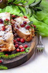 Delicious cranberry pie with fresh cranberries and herbs for Christmas on wooden plate - 498512430