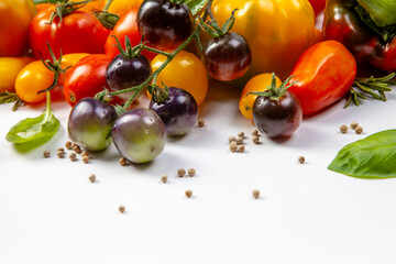 Assorted tomatoes and vegetables isolated on white background. Photo for your design. - 498512433