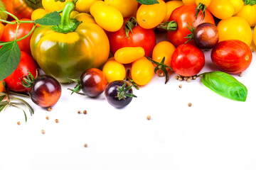 Assorted tomatoes and vegetables isolated on white background. Photo for your design. - 498512434