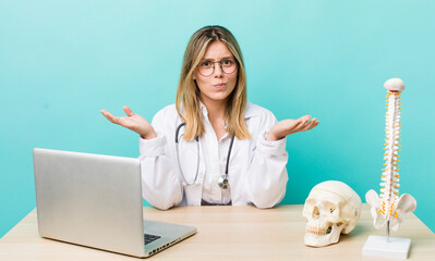 pretty blonde woman feeling puzzled and confused and doubting. spine specialist concept