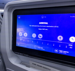 The monitor in the aircraft displays information about the unknown time of arrival at the destination