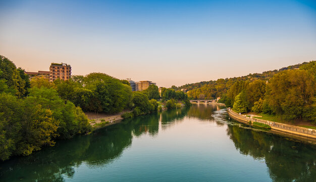Beautiful sunset view of the arch bridge over the river Po in the city of Turin, Italy