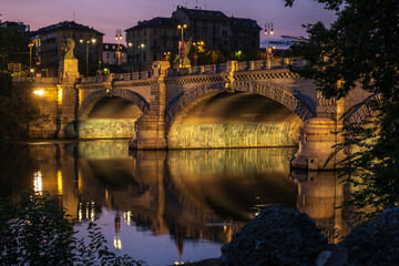 Beautiful night view of the bridge over the river Po in the city of Turin, Italy