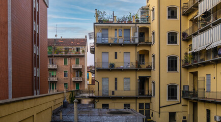 Fototapeta na wymiar View of Typical apartament building in the streets of Turin, Italy