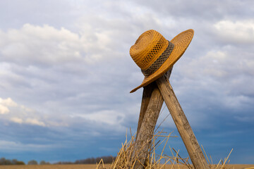 straw hat in countryside with selective focus