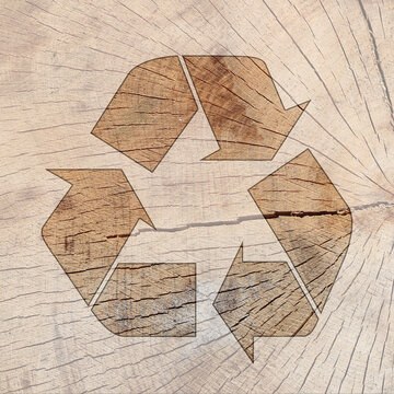 Symbole recyclage sur texture de bois