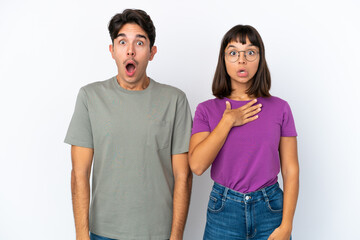 Obraz premium Young couple isolated on isolated white background with surprise and shocked facial expression