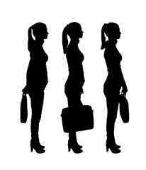 Vector silhouette of three business women with a case standing in profile