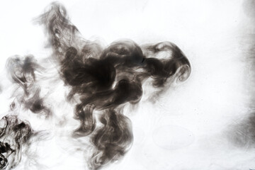 Dark smoke on white ink background, colorful fog, abstract swirling ocean sea, acrylic paint pigment underwater