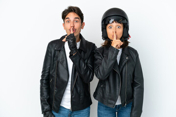 Young mixed race couple with a motorcycle helmet isolated on white background showing a sign of...