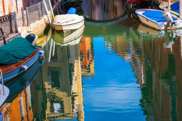 Fototapeta na wymiar Scenic view of Venice empty canals during daylight with sky reflections
