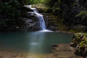 Fototapeta na wymiar Drinkable Water Source with Waterfall