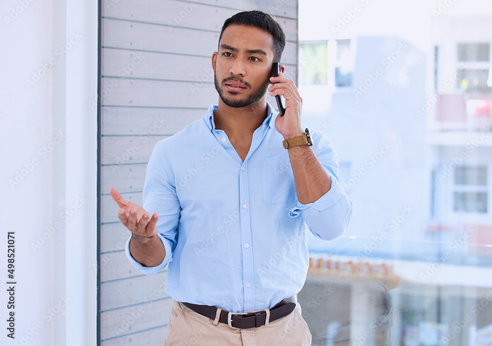 Poster look we need to discuss our project. shot of a young businessman using his smartphone to make a phon