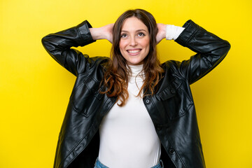 Young caucasian woman isolated on yellow background laughing