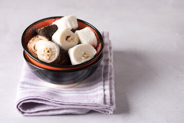 Tasty Turkish delight on Pink Napkin Gray Background Horizontal Copy Space Lokum