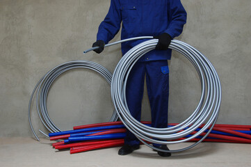Plumber installing plastic pipes