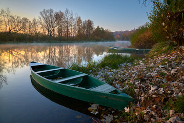 Two boats are on the river at the sunrise	in Ukraine