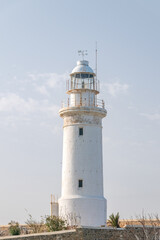 Fototapeta na wymiar The Paphos white lighthouse in Cyprus.