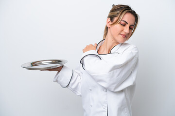 Young chef woman with tray isolated on white background suffering from pain in shoulder for having...