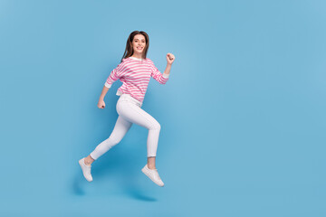 Full body profile photo of sportive pretty person hurry running isolated on blue color background
