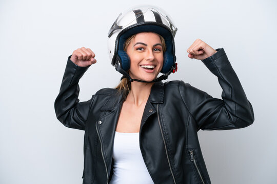Young caucasian woman with a motorcycle helmet isolated on white background doing strong gesture
